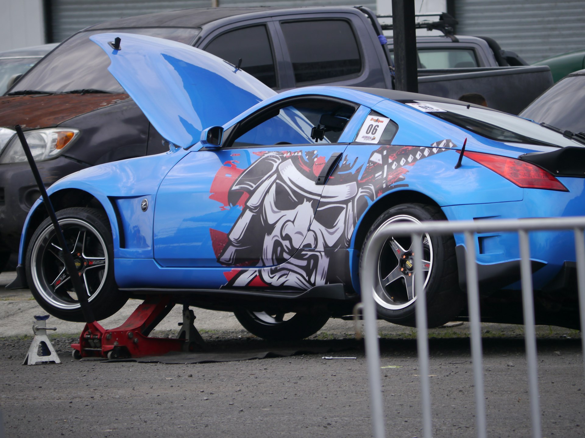 a blue car with a skull painted on it